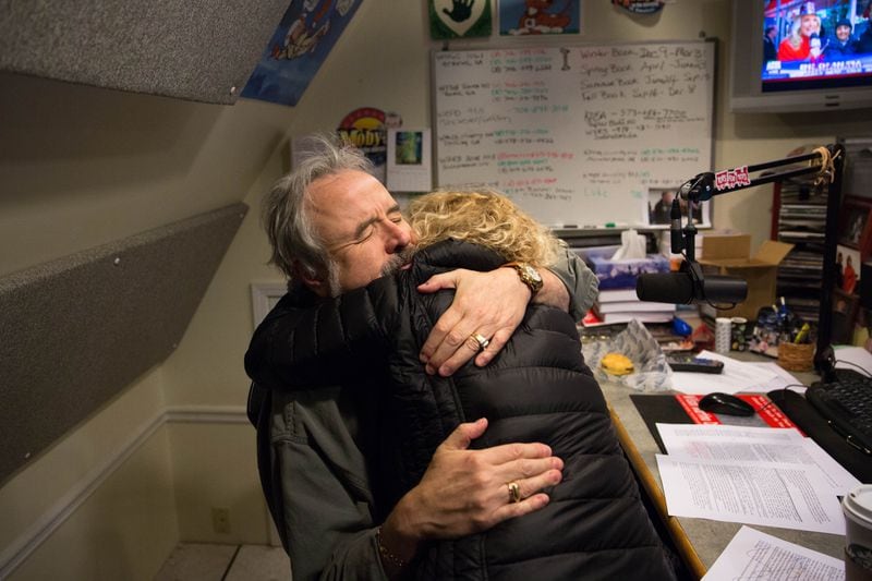 Radio host Moby, left, hugs former guest Corey Low, who came to visit during his last show, Friday, Dec. 30, 2016, in Roswell, Ga. Moby is retiring after a career of almost 50 years in radio. BRANDEN CAMP/SPECIAL