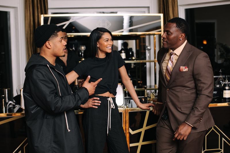 Sterling Shepard and Chanel Iman with Takeo Spikes. Photo: Lauren Cowart