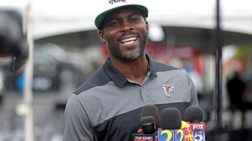 Former Atlanta Falcons quarterback Michael Vick speaks to members of the media during training camp at the Falcons Practice Facility, Wednesday, August 10, 2022, in Flowery Branch, Ga. (Jason Getz / Jason.Getz@ajc.com)