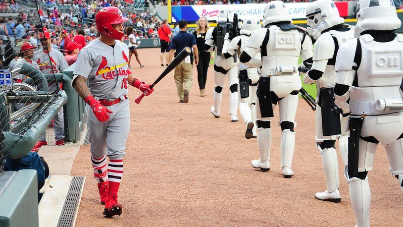 Kolten Wong of the St. Louis Cardinals interacts with a StormTrooper as he heads to the on deck circle on Stars Wars night at SunTrust Park. (Photo by Scott Cunningham/Getty Images)
