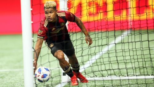 March 11, 2018.  Atlanta United forward Josef Martinez #7 pics up the ball inside the goal after scoring the first goal of the team on March 11, 2018 in Atlanta Ga..