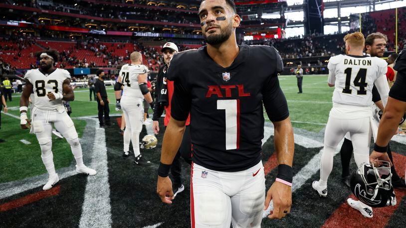 Falcons quarterback Marcus Mariota leaves the field after losing the season-opening game against the Saints on Sunday at Mercedes-Benz Stadium. (Miguel Martinez / miguel.martinezjimenez@ajc.com)