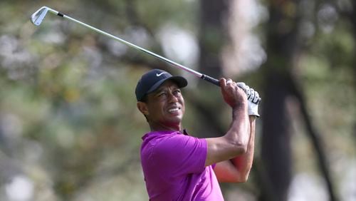 Tiger Woods tees off on No. 4 during the third round of the Masters at Augusta National Golf Club on Saturday, Nov 14, 2020, in Augusta.    (Curtis Compton / Curtis.Compton@ajc.com)