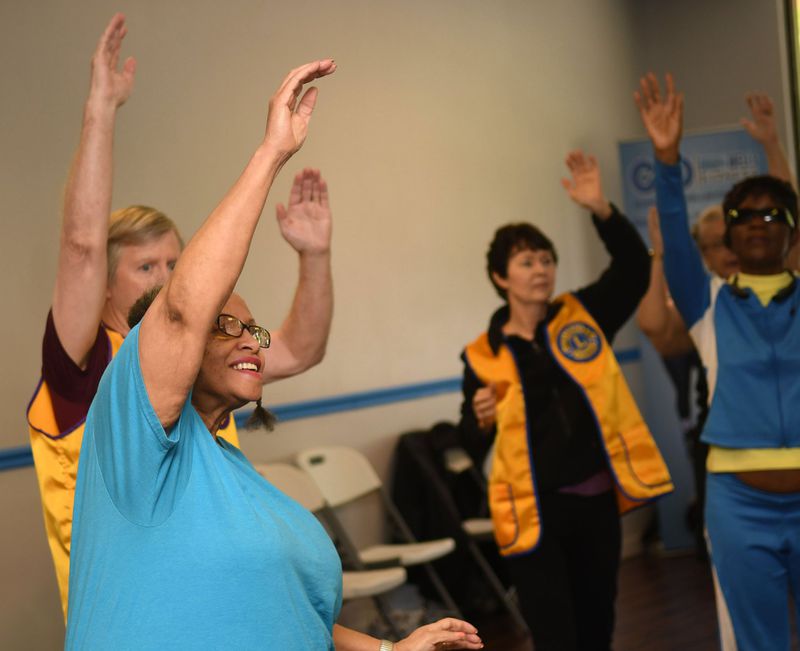Berniece Byrd of College Park takes part in a recent exercise class at Dawn Wells Fitness in Covington. Angel Eyes Fitness and Nutrition, a local nonprofit, provides exercise instruction to the blind and visually impaired. CONTRIBUTED BY REBECCA BREYER