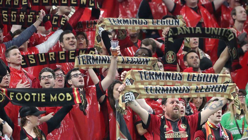 Atlanta United fans toast the team as they take on the D.C. United during their home opener Sunday, March 11, 2018, at Mercedes-Benz Stadium in Atlanta.