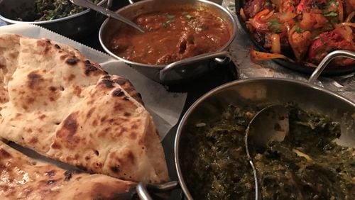 Palak paneer (bottom right) from Moon Indian Cuisine / Photo by Ligaya Figueras