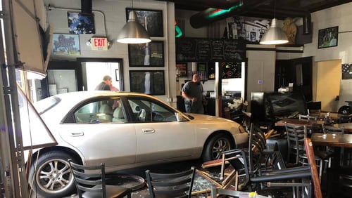 A woman accidentally drove into Rico's World Kitchen in Buford on Wednesday, police said.