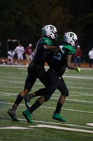 Marquis Willis (left), senior wide receiver for Roswell, and Ryan Stephens (right), junior running back for Roswell, celebrate as they run off of the field during the Mill Creek vs. Roswell high school football game on Friday, November 27, 2020, at Roswell High School in Roswell, Georgia. Roswell defeated Mill Creek 28-27. CHRISTINA MATACOTTA FOR THE ATLANTA JOURNAL-CONSTITUTION