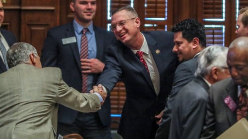 January 28, 2020 Atlanta: U.S. Rep. Doug Collins (center) shakes hands with members of the House before he addressed the Georgia House on Tuesday, Jan. 28, 2020 as its Chaplin of the day. This coming just hours after news broke that Collins is preparing to challenge U.S. Sen. Kelly Loeffler, and avoided any mention of seeking a higher office. In his sermon and closing prayer, Collins honored Rep. Jay Powell, the House Rules Committee chairman who died in November and who Collins described as a mentor. Speaker David Ralston signaled his support of the soon-to-be senate candidate, stopping short of an explicit endorsement. Collins and Ralston have a strong relationship dating back to their time as state house colleagues; Collins voted for Ralstonâ€™s speakership while deployed in Iraq. â€œHe is my friend. He has stood by me when few would,â€ Ralston said.â€And I donâ€™t forget things like that.â€ JOHN SPINK/JSPINK@AJC.COM