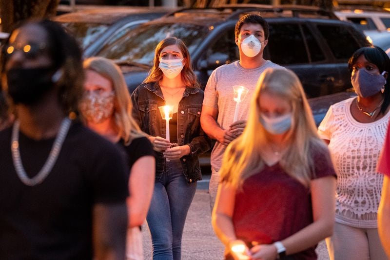 Abby Self, left, and  Dakota Palmisano attend a memorial service for Kyle Gregory at Brookwood High School on Friday evening July 24, 2020. (Ben Gray for the Atlanta Journal-Constitution)