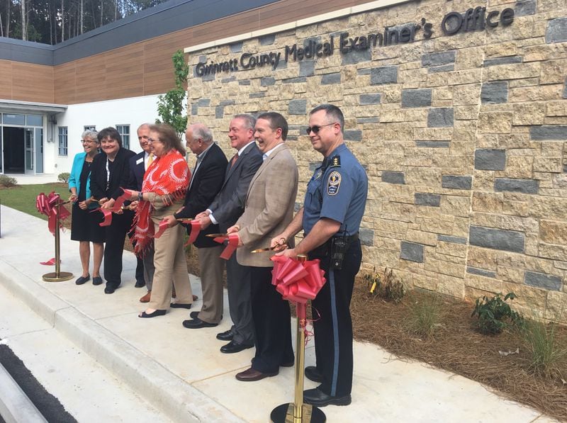 Gwinnett County Chief Medical Examiner Dr. Carol Terry, second from left, was joined by other officials during a Tuesday afternoon ribbon-cutting at the county's new morgue and medical examiner's facility.