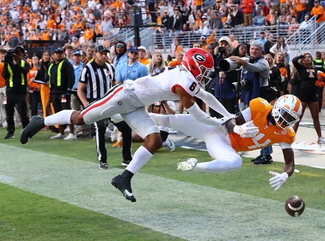 Georgia defensive back Daylen Everette breaks up a pass attempt in the endzone to Tennessee wide receiver Kaleb Webb during the second quarter in a NCAA college football game on Saturday, Nov. 18, 2023, in Knoxville.  Curtis Compton for the Atlanta Journal Constitution