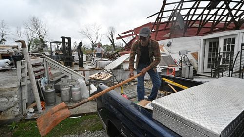 March 27, 2021 Newnan - Workers clean up destructed store at Mr. Carpet on Spence Avenue in the aftermath of the tornado that tore through the Newnan on Saturday, March 27, 2021. Storms that rolled through North Georgia late Thursday into Friday left a path of destruction, killing one person and injuring others. Most of metro Atlanta was spared from major damage, but Bartow and Polk counties - in northwest Georgia - and Coweta County south of Atlanta took the brunt of the impact. Late Friday, the National Weather Service said it was an EF4 tornado with 170-mph winds that hit Coweta. (Hyosub Shin / Hyosub.Shin@ajc.com)