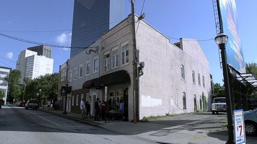 The building where Fiddlin’ John Carson recorded the first country music hit in 1923 still stands at 152 Nassau Street in downtown Atlanta, but developers of a Margaritaville-themed hotel, timeshare rental and restaurant acquired a permit earlier this month to demolish it. (Tyson Horne / Tyson.Horne@ajc.com)