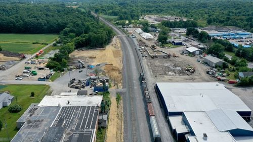 An aerial photo shows cleanup and remediation continuing on the site of the Feb. 3 Norfolk Southern freight train derailment, Saturday, July 15, 2023, in East Palestine. (Matt Freed for The Atlanta Journal-Constitution)