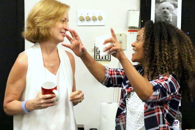 Tinashe Kajese-Bolden (right) speaks with former Alliance artistic director Susan V. Booth. Kajese-Bolden became interim co-artistic director when Booth announced she was leaving the Alliance last year. Photo:  the Alliance Theatre