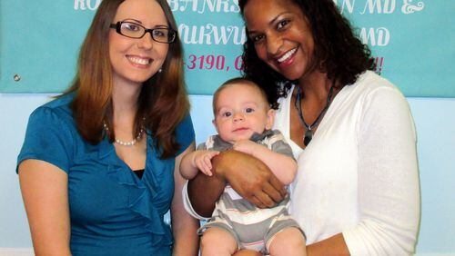 Dr. Roslyn Banks-Jackson (right), who works at Emanuel Medical Center and is the sole obstetrician-gynecologist in Emanuel County, delivered Brandi Eversole’s son Caden by emergency C-section last December. The doctor and her patients fear what will happen to pregnant women in that rural area if Emanuel Medical closes its labor and delivery unit.