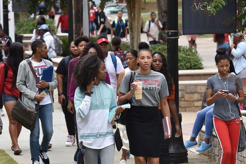 Kendall Youngblood chats with her friend Mia Williams, left, as they walk through campus at Clark Atlanta University on Tuesday, August 29, 2017. (HYOSUB SHIN / HSHIN@AJC.COM)