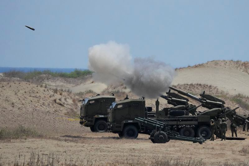 Philippine Army fires ATMOS 155mm howitzers during a joint military exercise on Wednesday, May 8, 2024, in Laoag, Ilocos Norte, northern Philippines. American, Australian and Filipino forces launched a barrage of high-precision rockets, artillery fire and airstrikes to sink a ship Wednesday as part of largescale war drills in waters facing the disputed South China Sea that has antagonized Beijing. (AP Photo/Aaron Favila)