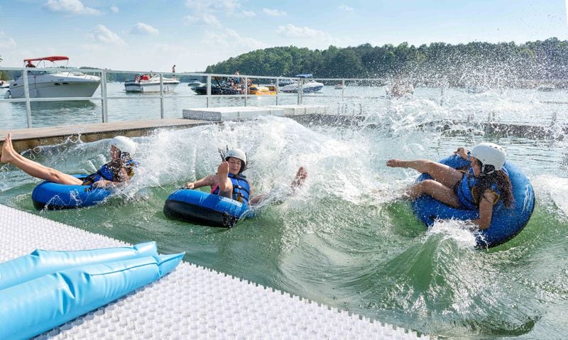 A four-lane CAT4 Tube Slide at LanierWorld sends racers into Lake Lanier.LanierWorld has decided to extend its summer season — by a lot — this year. The water park will remain open through Oct. 1.CONTRIBUTED BY LANIERWORLD