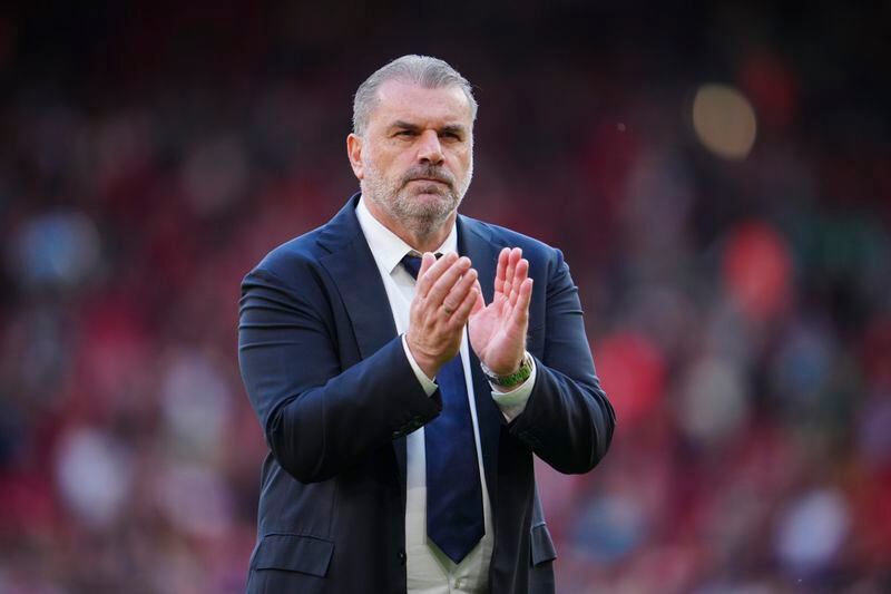 Tottenham's head coach Ange Postecoglou applauds to fans at the end of the English Premier League soccer match between Liverpool and Tottenham Hotspur at Anfield Stadium in Liverpool, England, Sunday, May 5, 2024. (AP Photo/Jon Super)