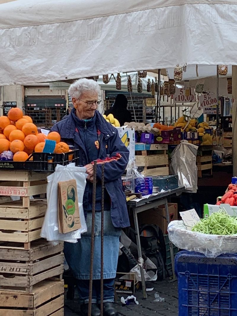 A vendor oversees her goods at Campo de’ Fiori, one of the oldest markets in Rome. CONTRIBUTED BY ASHA GOMEZ