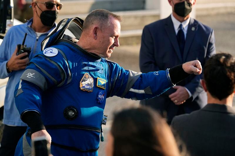 NASA astronaut Butch Wilmore gives an air fist bump to well-wishers as he leaves the Operations and Checkout building before heading to Space Launch Complex 41 to board Boeing's Starliner capsule atop an Atlas V rocket for a mission to the International Space Station at the Cape Canaveral Space Force Station Monday, May 6, 2024, in Cape Canaveral, Fla. (AP Photo/John Raoux)
