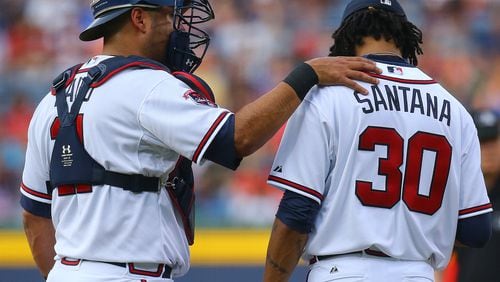 ***TIGHTER CROP OF PREVIOUS PHOTO****061714 ATLANTA: Braves catcher Gerald Laird confers with pitcher Ervin Santana after he gives up a 2-run homer to Phillies Ryan Howard during the first inning of an MLB game on Tuesday, June 17, 2014, in Atlanta. CURTIS COMPTON / CCOMPTON@AJC.COM Ervin Santana was dinged early with a first-inning homer by Philadelphia's Ryan Howard. (Curtis Compton)