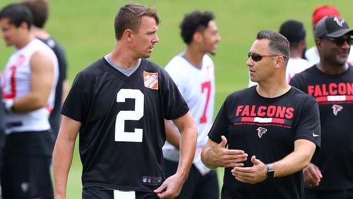 Atlanta Falcons offensive coordinator Steve Sarkisian works with Matt Ryan during the final day of mandatory minicamp  Thursday, June 14, 2018, in Flowery Branch.