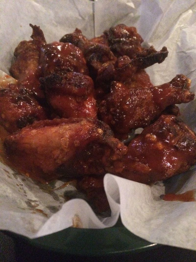 A good way to start a meal at Krazie Barbecue is by sharing a basket of smoky chicken wings; these are drizzled with Krazie Spicy barbecue sauce. CONTRIBUTED BY WENDELL BROCK