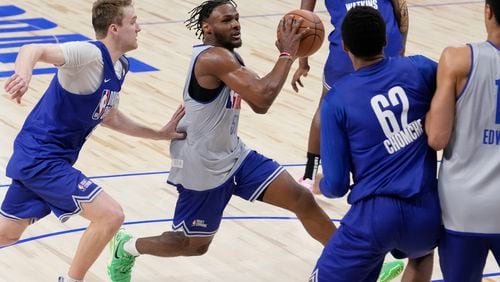 Bronny James (50), second from left, drives to the basket past Cam Spencer, left, during the 2024 NBA basketball Draft Combine in Chicago, Tuesday, May 14, 2024. (AP Photo/Nam Y. Huh)