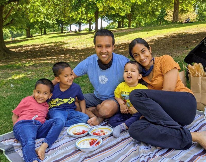 The Tiwari family picnic at Piedmont Park on Mother’s Day 2021. This was a month after Yuvi was hospitalized for a seizure and sent home on hospice care. (Shown L-R: Twin brothers Arjun and Akshay; father Satya; Yuvi, wearing a t-shirt in his favorite color yellow; and mother Parvati).