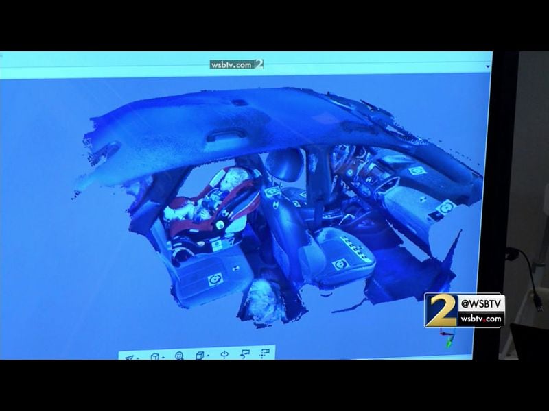 The prosecution shows cutaway details of a 3D laser scan of Justin Ross Harris' SUV, during Harris' murder trial at the Glynn County Courthouse in Brunswick, Ga., on Friday, Oct. 28, 2016. (screen capture via WSB-TV)