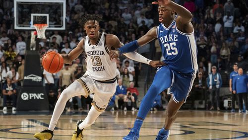 Georgia Tech guard Miles Kelly (13) drives to the basket against Duke forward Mark Mitchell (25) in the second half of an NCAA college basketball game Saturday, Dec. 2, 2023, in Atlanta. (AP Photo/Hakim Wright Sr.)