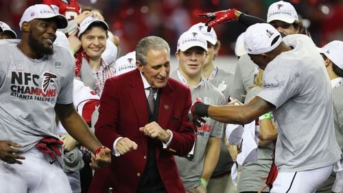 Falcons owner Arthur Blank dances on stage with his players after beating the Packers 44-21 in the NFL football NFC Championship game earning a trip to the Super Bowl.     Curtis Compton/ccompton@ajc.com