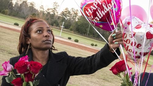 Cynthia Metts gathers balloons from her car for she and her siblings to take to their mother’s grave on her mother’s (Renee Metts) birthday, Monday, Nov.13, 2017 in Palmetto, Ga. Fulton County is terminating a contract it had for Morehouse School of Medicine to provide medical care for its inmates because, according to a letter, its doctors had failed to provide adequate care. Jail officials attribute at least five inmate deaths to that sub-par care. (Contributed by John Amis) AJC FILE PHOTO