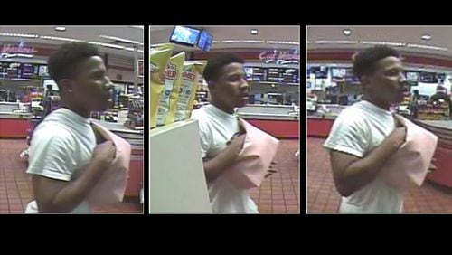 Gwinnett County police are looking for this man and two other people in connection with a robbery.