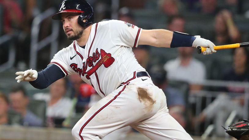 Atlanta Braves catcher Travis d'Arnaud rips a single against the Cincinnati Reds during the 6th inning of a MLB baseball game on Wednesday, August 11, 2021, in Atlanta.   (Curtis Compton / Curtis.Compton@ajc.com)