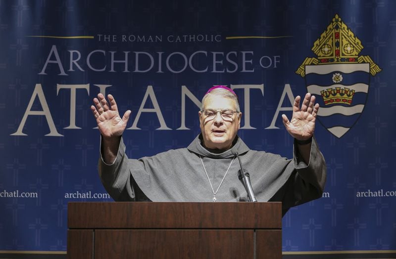 Archbishop Gregory John Hartmayer extends a Franciscan blessing to all in attendance at the end of his March 5 press conference. Pope Francis named Hartmayer the seventh archbishop for the Archdiocese of Atlanta. CONTRIBUTED BY MICHAEL ALEXANDER