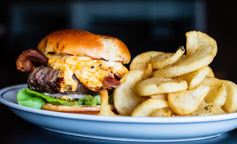 The Public Kitchen & Bar serves a pimento cheese burger topped with bacon and an exceptionally creamy version of pimento cheese. CONTRIBUTED BY HENRI HOLLIS