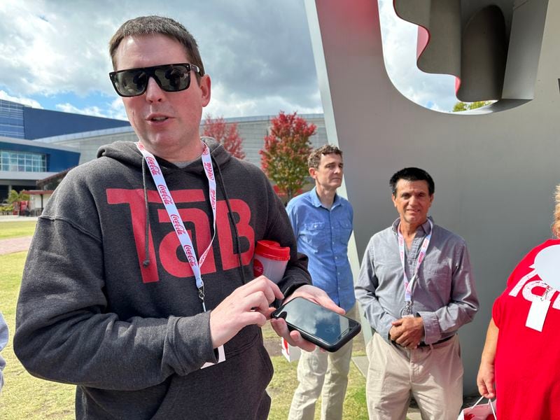 Adam Burbach, a 41-year-old Nebraskan who spearheaded the Save TaB group, at the World of Coke with a group of his TaB buddies on Oct. 20, 2023. RODNEY HO/rho@ajc.com
