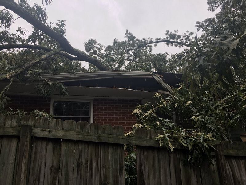 A DeKalb County home sustained severe damage after a tree fell on it overnight. (Credit: Channel 2 Action News)