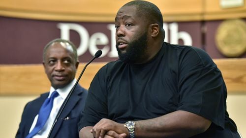 July 7, 2016 Decatur - Rapper Killer Mike (right) speaks as Michael Thurmond, next CEO of DeKalb County, looks during a town hall meeting at the Maloof Auditorium in Decatur on Wednesday, July 7, 2016. Michael Thurmond, who is a November vote away from being declared the next CEO of DeKalb County, has peacemaking on his mind. With Killer Mike and some other friends. Thurmond will be one of four Georgians on the platform committee of the Democratic National Convention, which gathers later this month in Philadelphia. A hard draft of the document is expected to be voted on later this week at a meeting in Florida. HYOSUB SHIN / HSHIN@AJC.COM