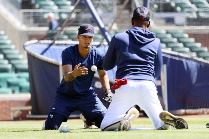 Braves third base coach Ron Washington (right) helps shortstop Vaughn Grissom with a drill during warm-ups before the game against the Astros at Truist Park, Sunday, April 23, 2023, in Atlanta. Miguel Martinez / miguel.martinezjimenez@ajc.com 