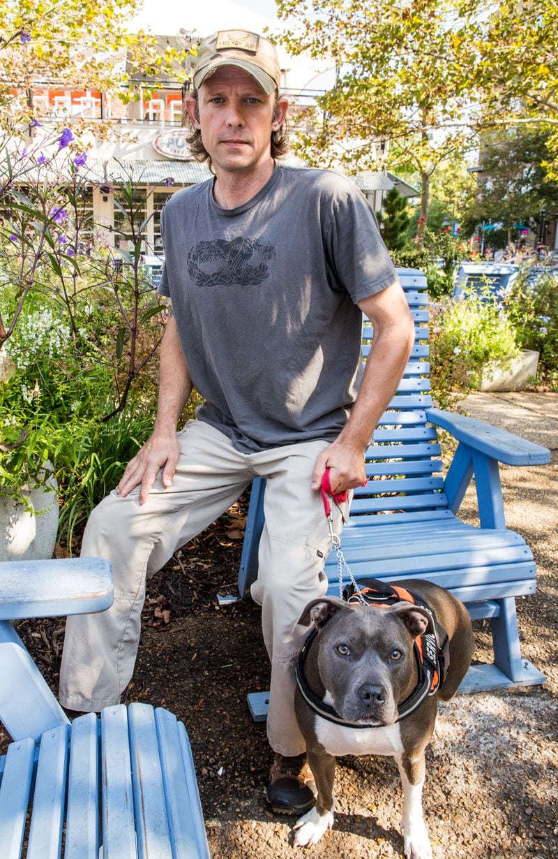 James Yarbrough, an Air Force veteran, with his Straffordshire terrier and service dog Trixie. Yarbrough has a spinal cord injury and other medical problems associated with his time loading ordnance on jets. He has had trouble getting doctor appointments through the VA for more than a year. (Jenni Girtman for The Atlanta Journal-Constitution)