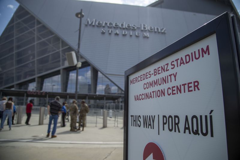 03/30/2021 —Atlanta, Georgia — The entrance to the Mercedes-Benz Stadium Community Vaccination Center in Atlanta, Tuesday, March 30, 2021. (Alyssa Pointer / Alyssa.Pointer@ajc.com)