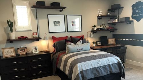 A black and red color combination makes a bold statement in this boy’s bedroom. (Design Recipes)