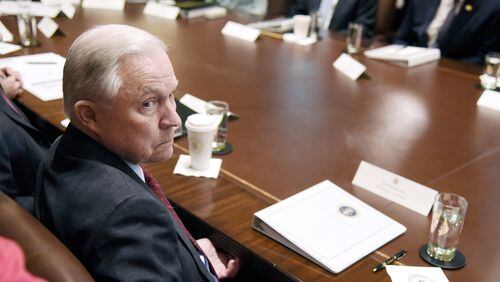 Attorney General Jeff Sessions looks on during a Cabinet meeting in the the White House last week. Olivier Douliery/Abaca Press/TNS