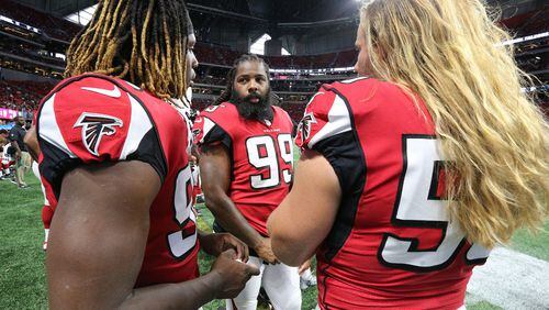 August 31, 2017 Atlanta: Falcons Takkarist McKinley (from left), Adrian Clayborn, and Brooks Reed confer on the sidelines against the Jaguars in a NFL preseason football game on Thursday, August 31, 2017, in Atlanta. They will now be counted on to replace Vic Beasley, who set to miss at least one game and perhaps a few more. Curtis Compton/ccompton@ajc.com