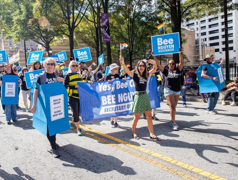 Bee Nguyen is on the campaign trail at the Pride Parade on Peachtree Street on Sunday, Oct.9, 2022.  (Jenni Girtman for The Atlanta Journal-Constitution)